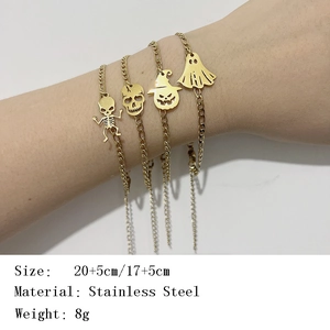 Gold stainless steel Halloween bracelet featuring skull, ghost, and pumpkin charms