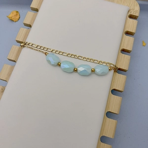 Bracelet double couche en acier titane doré avec perles en étoile et cristaux bleus