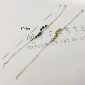 Gold star and moon charm bracelet with blue beads and 17+5cm adjustable chain