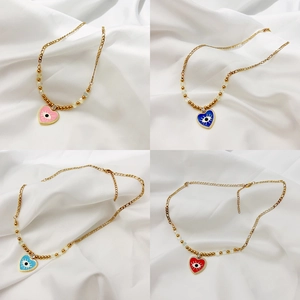 Collier en titane plaqué or 18K avec pendentifs cœur mauvais œil en quatre couleurs