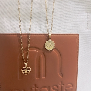 Collane in acciaio inossidabile placcato oro 18k con ciondoli a cuore e malocchio