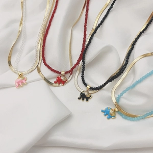 Double-layered gold snake chain necklaces with colorful beads and elephant pendants