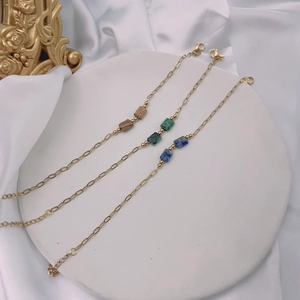 Three-piece gold link chain bracelets with square turquoise and natural stone accents