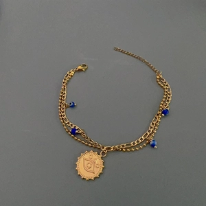 Double-layer 18K gold evil eye bracelet with blue beads and polished stainless steel beads