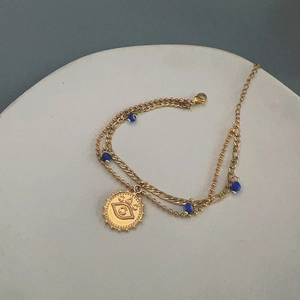 Double-layer 18K gold stainless steel evil eye bracelet with blue beads and coin pendant