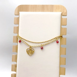 Double-layered gold beaded bracelet with red evil eye charms and heart-shaped pendant
