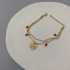 Vintage gold layered stainless steel bracelet with evil eye heart charm and red beads