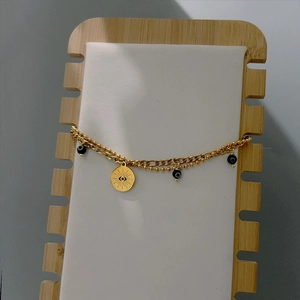 Bracciale dorato a doppio strato malocchio con ciondolo a raggiera e perline nere