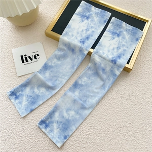 Close-up of blue and white tie-dye ice silk cooling sleeves with breathable fabric texture