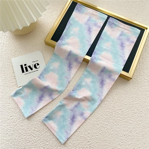 Close-up of long ice silk cooling sleeves with pastel pink and blue tie-dye pattern