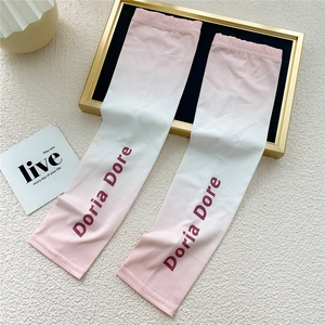 Detail of pink gradient cooling sun sleeves with Doria Dore logo on a white background