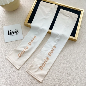Detail view of off-white ice silk cooling sleeves with elegant Doria Dore lettering