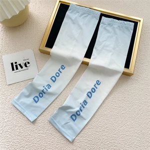 Detail of gradient ice silk cooling sleeves with blue Doria Dore lettering and knit texture