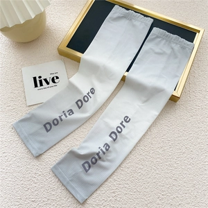 Detail of grey gradient ice silk sun sleeves with elastic cuffs and Doria Dore logo