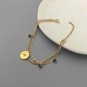 Bracciale a doppio strato dorato malocchio con ciondolo a sole e catena a maglia piatta