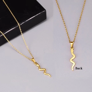 Vintage gold snake S-shaped pendant necklace with 3D scale texture on fine cross chain