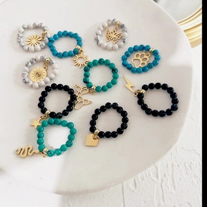 Set of 10 beaded elastic rings featuring natural turquoise stones and gold charms