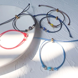 Handwoven Evil Eye bead bracelets with adjustable stainless steel sliders in multiple colors