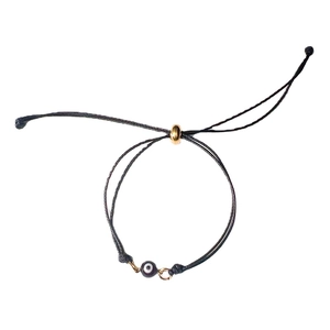 Adjustable evil eye braided cord bracelet with blue bead and gold slider closure