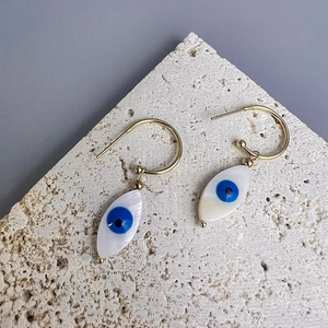 Golden Evil Eye drop earrings with marquise shell inlay and ethnic protective charms