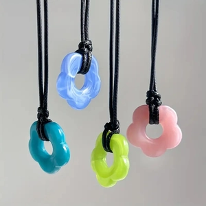Bohemian floral resin necklaces with ink marble texture on black cord in four colors