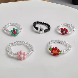 5-piece set of handmade elastic beaded flower rings in vibrant multicolor styles