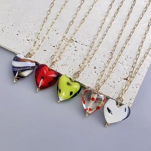 Set of five stainless steel necklaces featuring colorful hand-painted glass heart pendants