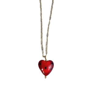 Polished gold chain necklace featuring a red hand-painted glass heart pendant