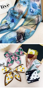 Gros plan de foulards en soie imprimés avec motifs floraux et textures à pois