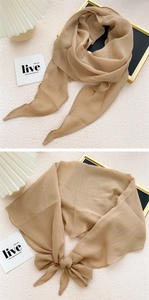 Detail of soft champagne rhombic silk scarf showing elegant semi-transparent texture