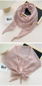 Detail view of a soft pink chiffon rhombus scarf with elegant folded texture and hemmed edges