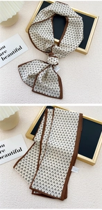 Vue détaillée d'un foulard en soie étroit avec motifs géométriques fléchés beige et noir