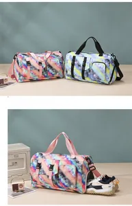 Detail showing a colorful tie-dye travel bag with independent shoe compartment storage
