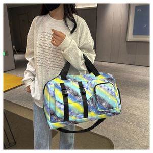 Detail of colorful gradient sports bag showing adjustable black straps and side pockets