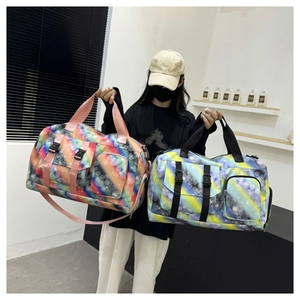 Detail of colorful yoga travel bag featuring star bubble print and adjustable shoulder straps