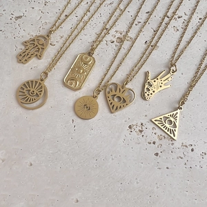 Minimalist 18K gold stainless steel necklaces with hollow evil eye and Hamsa pendants