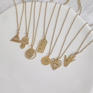 Set of eight 18K gold plated stainless steel necklaces with hollow evil eye pendants