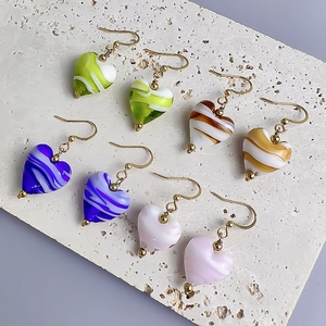 Colorful heart-shaped glass earrings with marble patterns and gold-plated hooks