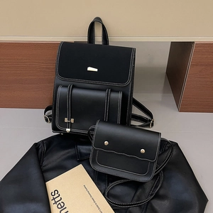 Fashionable black PU leather backpack set with contrast white stitching and gold buckles