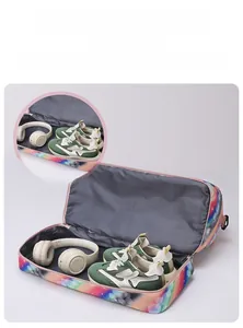 Travel bag featuring a separate ventilated shoe compartment and spacious main storage