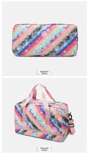 Detail view of pink rainbow travel bag showing a separate waterproof bottom compartment