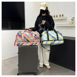 Detail of travel duffel bags with separate bottom shoe compartment and colorful stripes