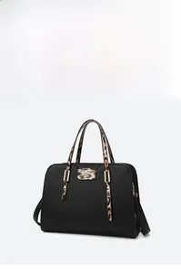 Detail of large black pebbled leather tote bag with stylish leopard print handle and accents