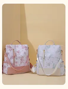Detail of modern butterfly print backpacks with front zip pocket and side pouches