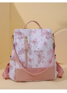 Detail of butterfly print backpack showing side pocket and high-quality fabric texture