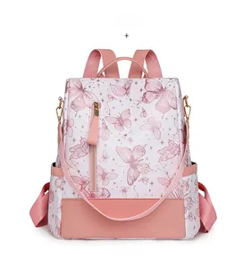 Detailed view of pink butterfly print backpack with stars and zipper closure