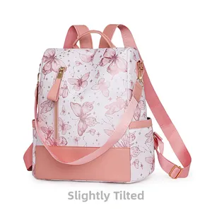 Detail view of the pink butterfly print and stitching on the stylish school backpack