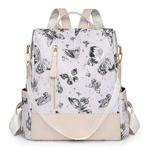 White butterfly print backpack with cream leather trim and gold-tone hardware detail