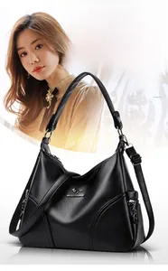 Close-up of black lychee grain leather handbag with kangaroo logo and side zipper pocket