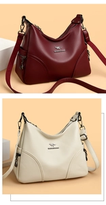Detailed view of large-capacity crossbody bags in burgundy and beige textured leather